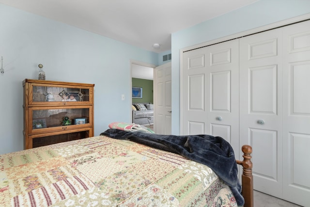 bedroom featuring visible vents and a closet