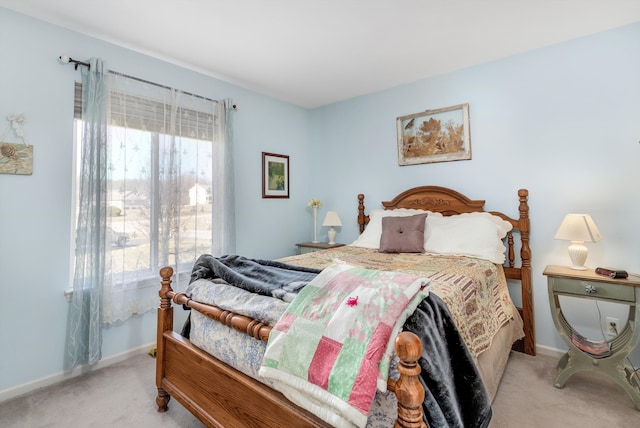 bedroom with carpet and baseboards