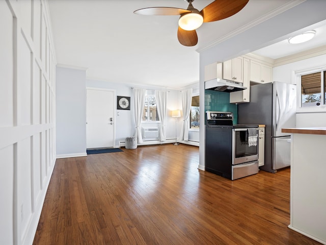 kitchen featuring under cabinet range hood, white cabinets, dark wood-style flooring, and appliances with stainless steel finishes