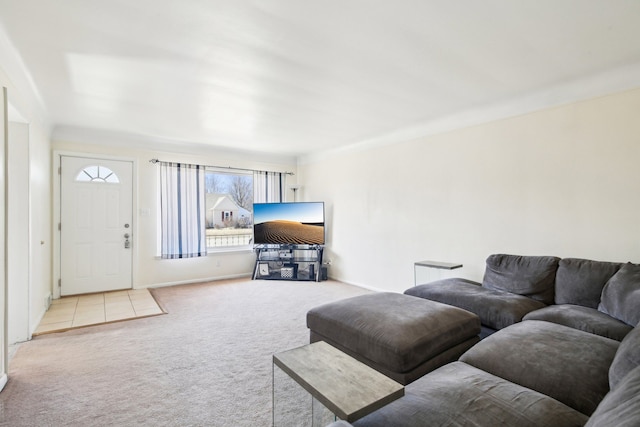 carpeted living room featuring baseboards