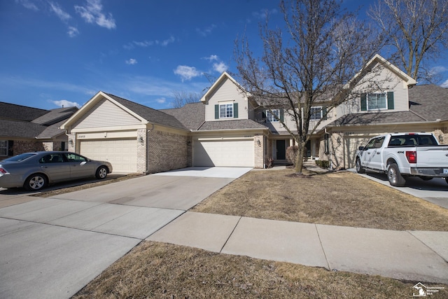 view of front of property featuring concrete driveway, brick siding, and roof with shingles