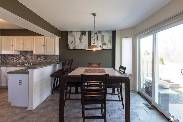 dining area featuring tile patterned flooring