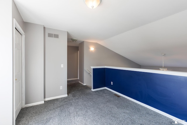 bonus room featuring visible vents, baseboards, lofted ceiling, and carpet