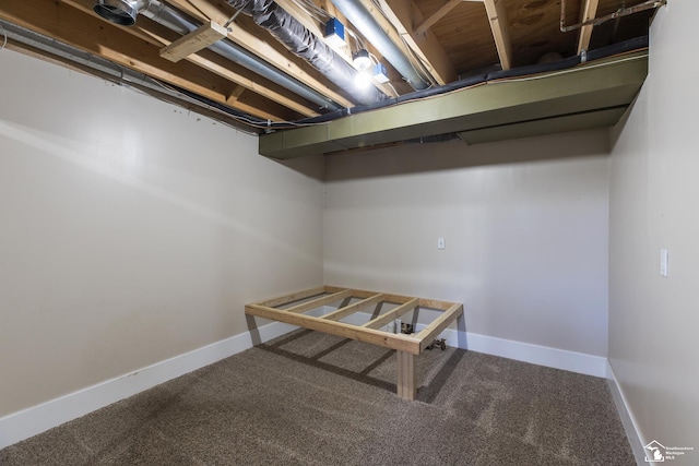 unfinished basement with carpet flooring and baseboards