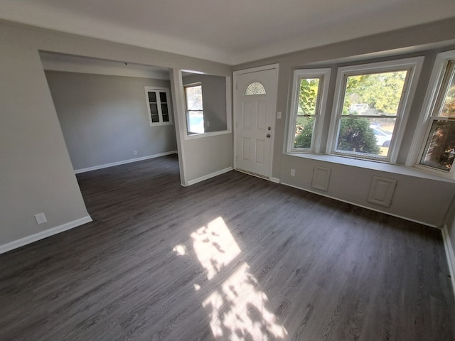 entrance foyer featuring dark wood-style floors and baseboards