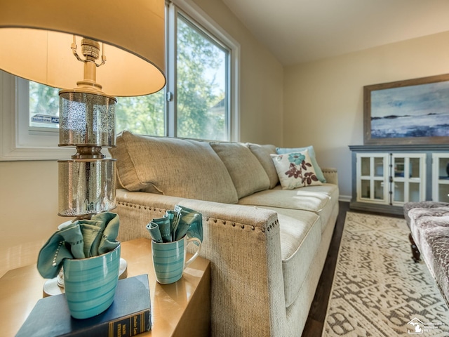 living area featuring lofted ceiling