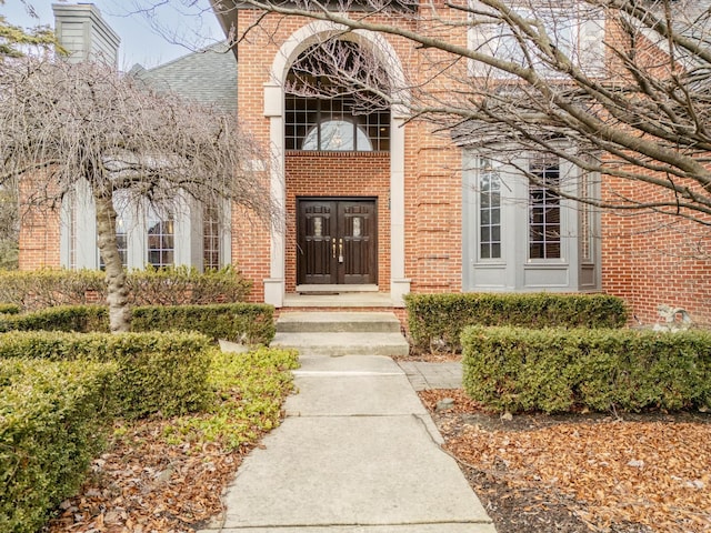 property entrance with brick siding