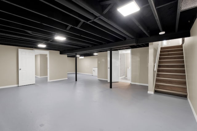 finished basement with baseboards and stairs