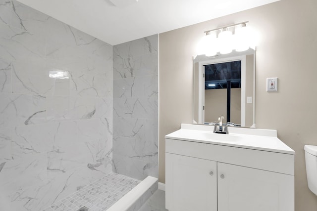 full bath with vanity, a shower stall, toilet, and marble finish floor