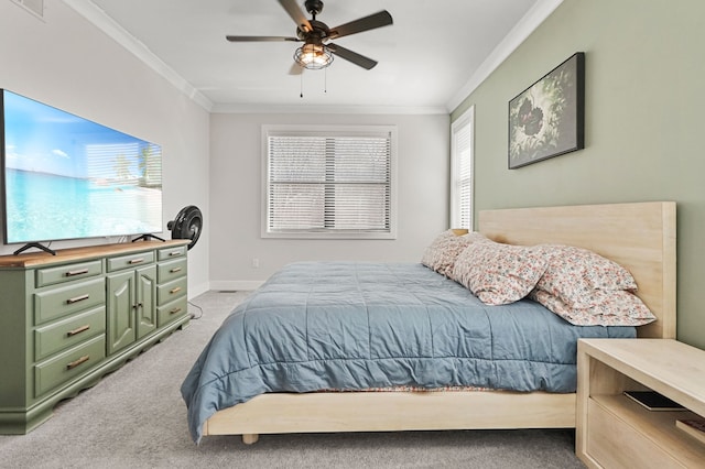 bedroom featuring light carpet, baseboards, ceiling fan, and ornamental molding