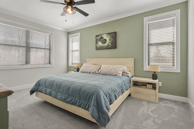 bedroom featuring ceiling fan, baseboards, carpet, and ornamental molding