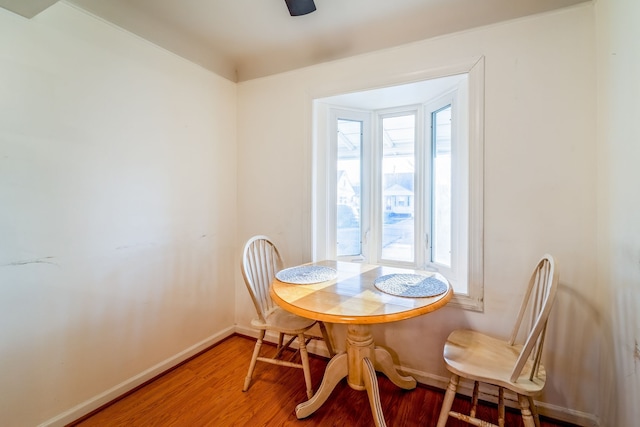 dining room with light wood-style floors and baseboards