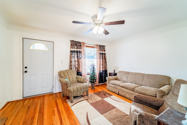 living room with ceiling fan and wood finished floors