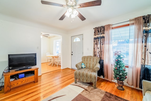 living room featuring wood finished floors and ceiling fan