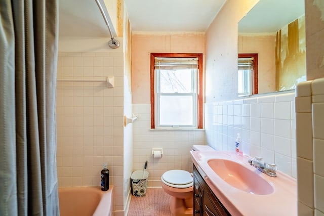 bathroom with tile patterned flooring, tile walls, toilet, shower / bath combination with curtain, and vanity