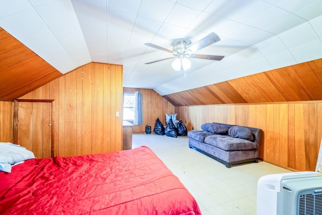 bedroom featuring wooden walls, a ceiling fan, and vaulted ceiling