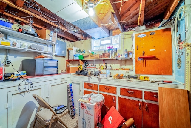 kitchen featuring light countertops and open shelves