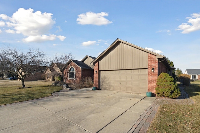 view of front of house with brick siding, an attached garage, concrete driveway, and a front yard