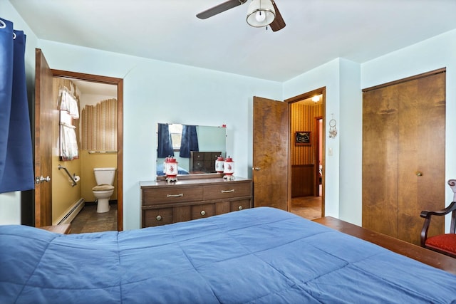 bedroom featuring connected bathroom, a ceiling fan, and a baseboard heating unit