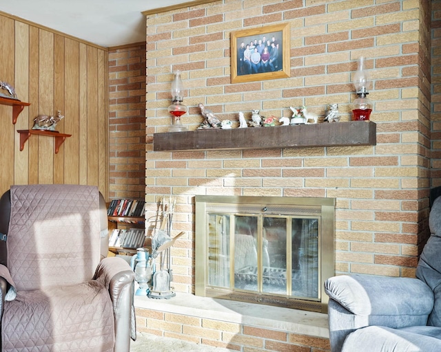 interior space with wooden walls and a fireplace