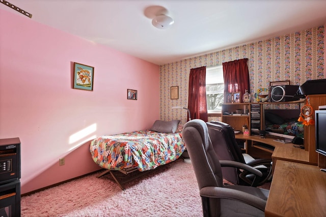 bedroom with carpet and wallpapered walls