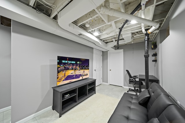 interior space with visible vents, concrete flooring, and baseboards