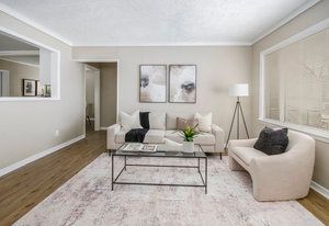 living room featuring wood finished floors and baseboards