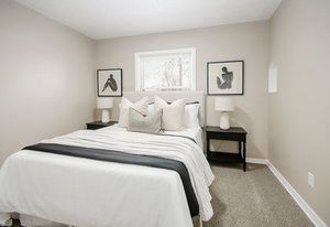 carpeted bedroom with baseboards