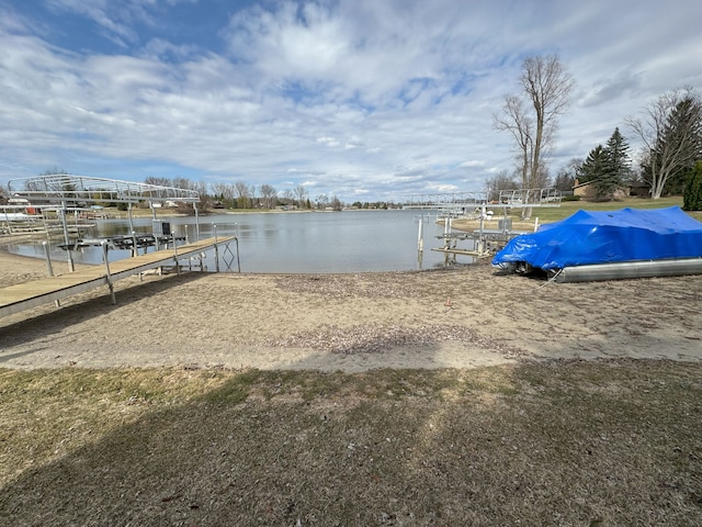 view of dock featuring boat lift and a water view