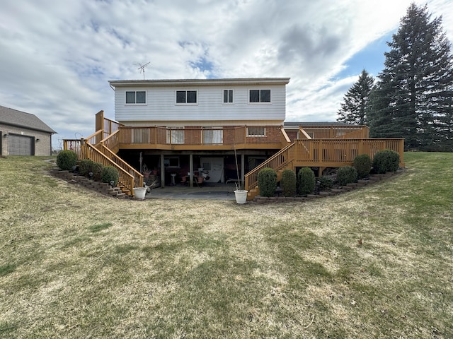 rear view of house with a lawn, stairs, and a deck