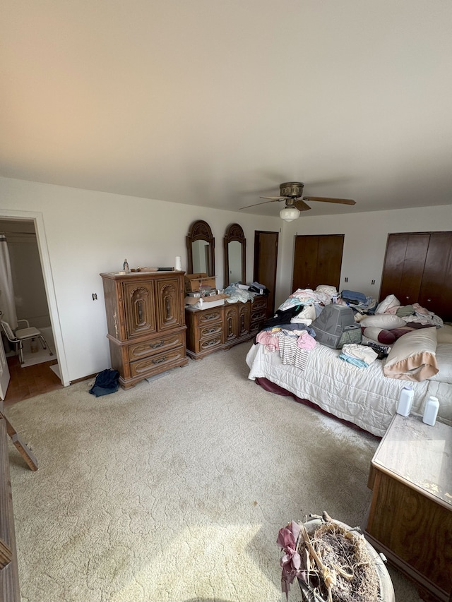 carpeted bedroom featuring a ceiling fan