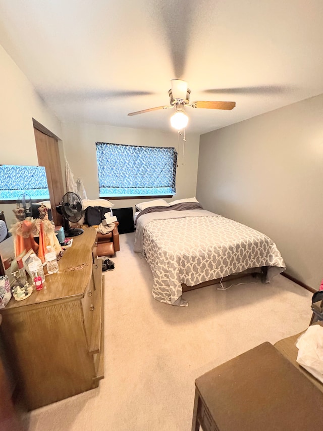 bedroom featuring carpet floors and a ceiling fan