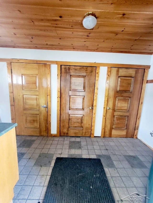 interior space with lofted ceiling and wooden ceiling