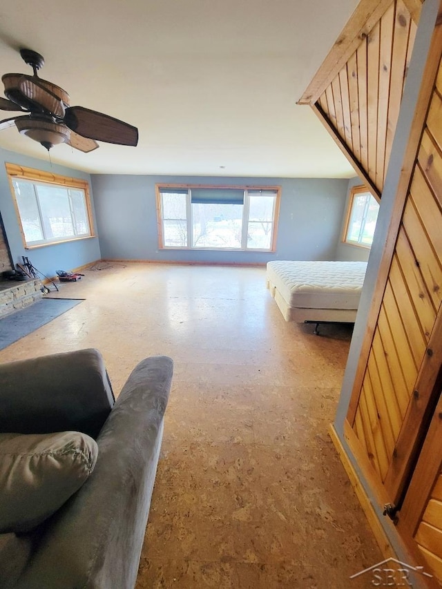 living area with ceiling fan