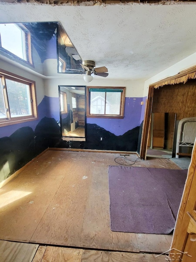 unfurnished room featuring a textured ceiling