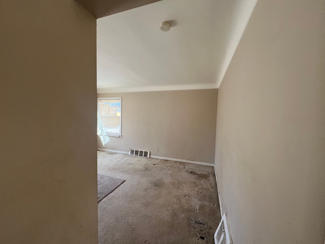 bonus room featuring baseboards, visible vents, and carpet floors