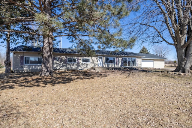 ranch-style house featuring a garage