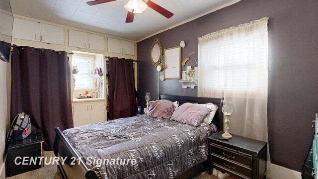 bedroom featuring crown molding and ceiling fan