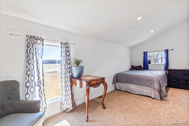 carpeted bedroom with vaulted ceiling, recessed lighting, and baseboards