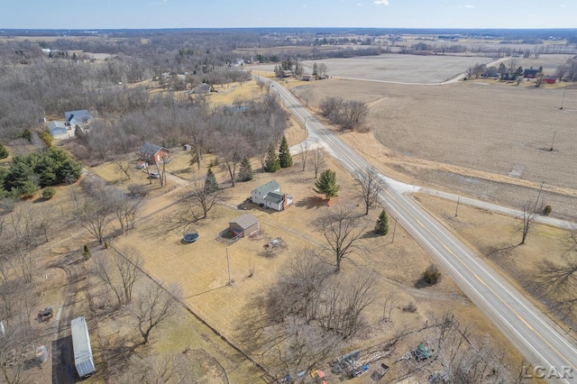 birds eye view of property with a rural view