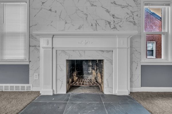 details featuring visible vents and a high end fireplace