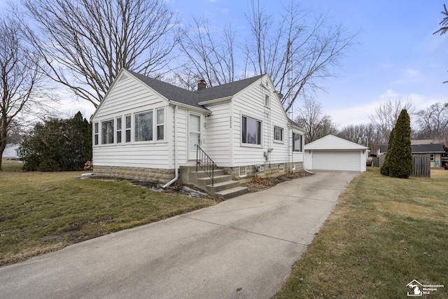 bungalow-style home featuring a detached garage, a front lawn, entry steps, a chimney, and an outdoor structure