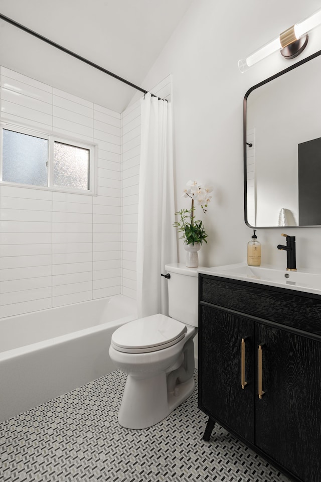 full bath with tile patterned floors, toilet, shower / tub combo with curtain, lofted ceiling, and vanity