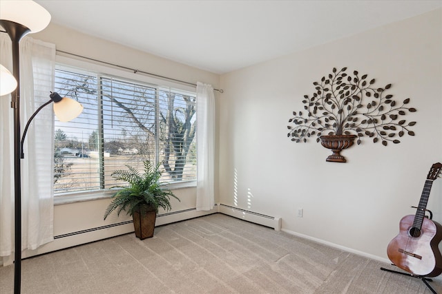 living area featuring carpet and baseboards