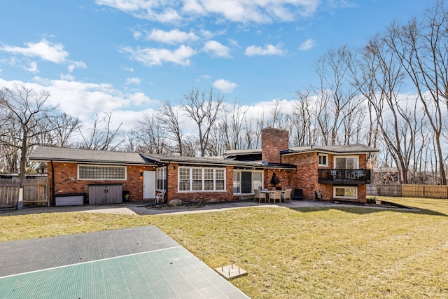 split level home with brick siding, a chimney, a front lawn, and fence