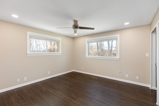 unfurnished room with visible vents, recessed lighting, wood finished floors, and baseboards