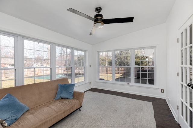 sunroom with lofted ceiling, plenty of natural light, and ceiling fan