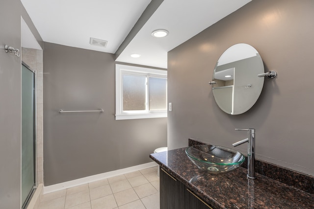 full bathroom featuring visible vents, an enclosed shower, toilet, tile patterned flooring, and baseboards