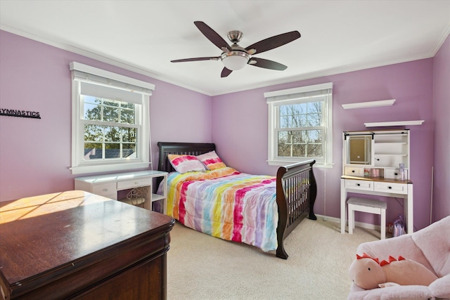 bedroom featuring baseboards, crown molding, a ceiling fan, and carpet floors