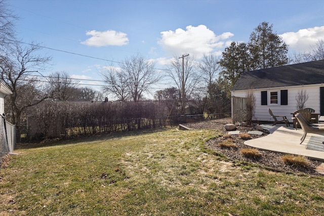 view of yard featuring a patio and fence